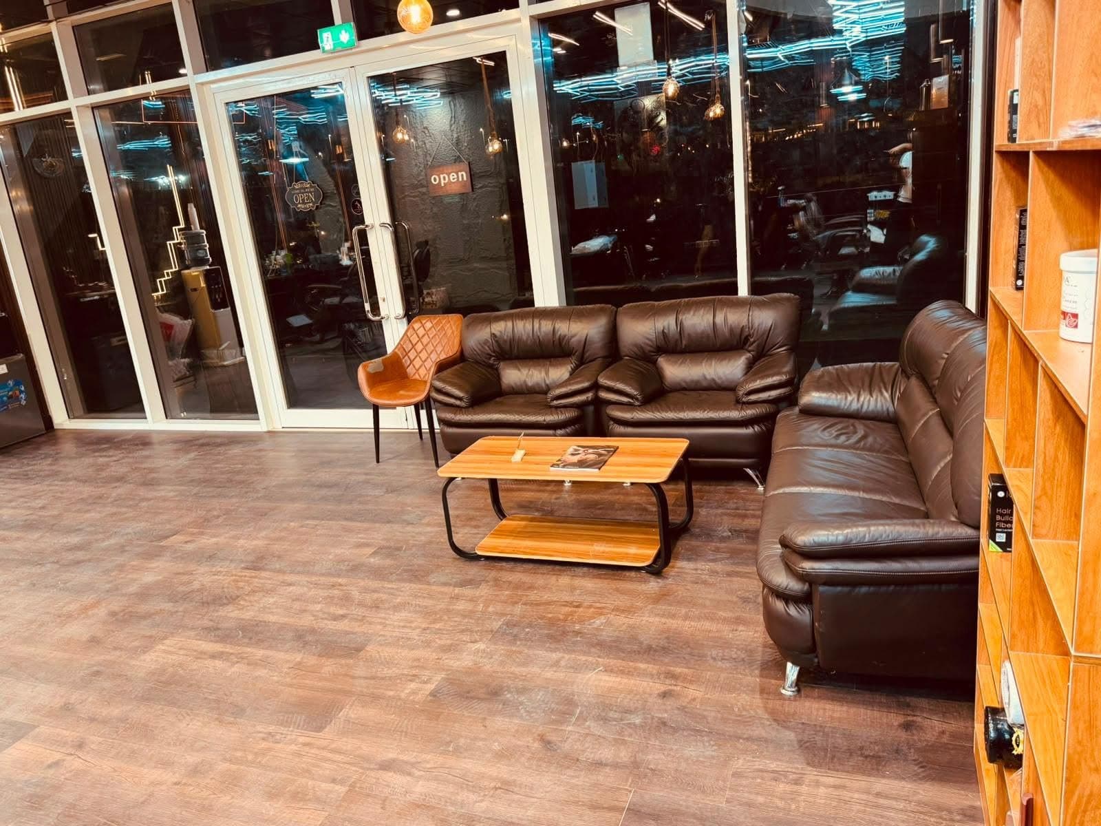 Leather sofas and a coffee table by the shop's front windows